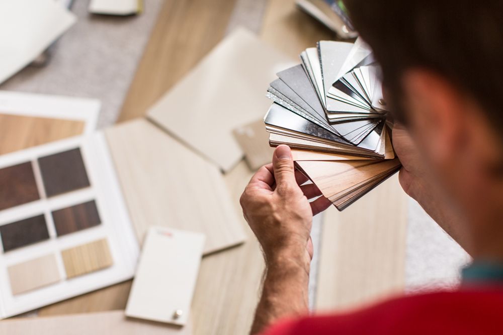 Man choosing flooring for his home — Hybrid Shield Flooring in Port Macquarie, NSW