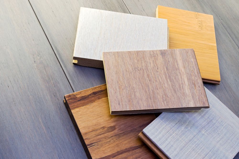 Pile of wooden flooring — Floor Coverings in South West Rocks, NSW