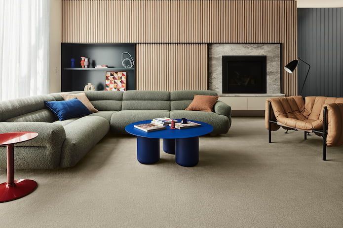 A Living Room With A Large Sectional Couch And A Blue Coffee Table — Floor Coverings in South West Rocks, NSW