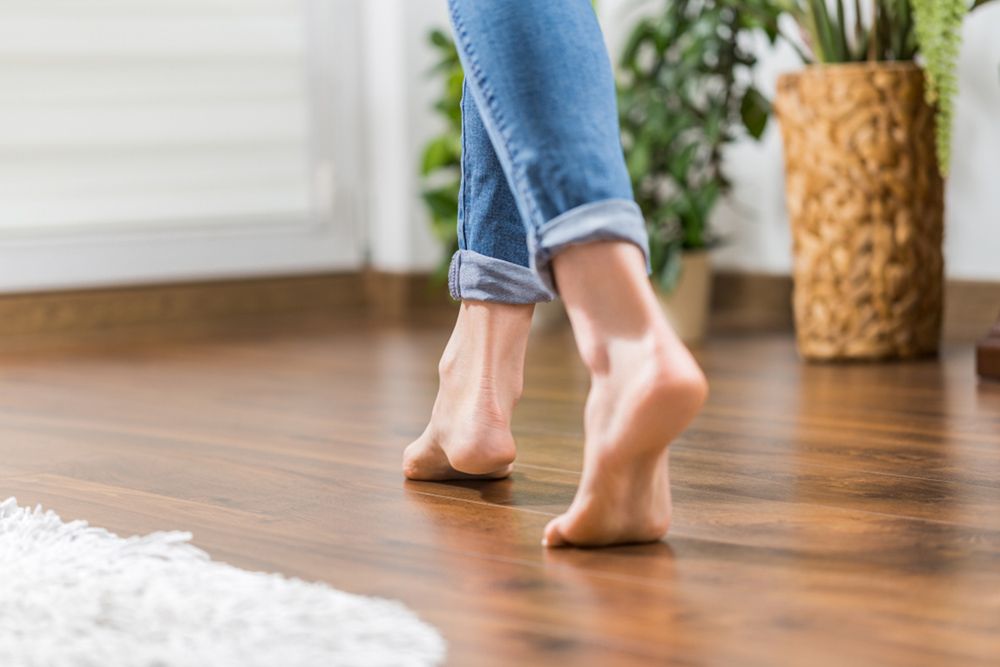 Woman walking in floor — Flooring Store Near Taree, NSW