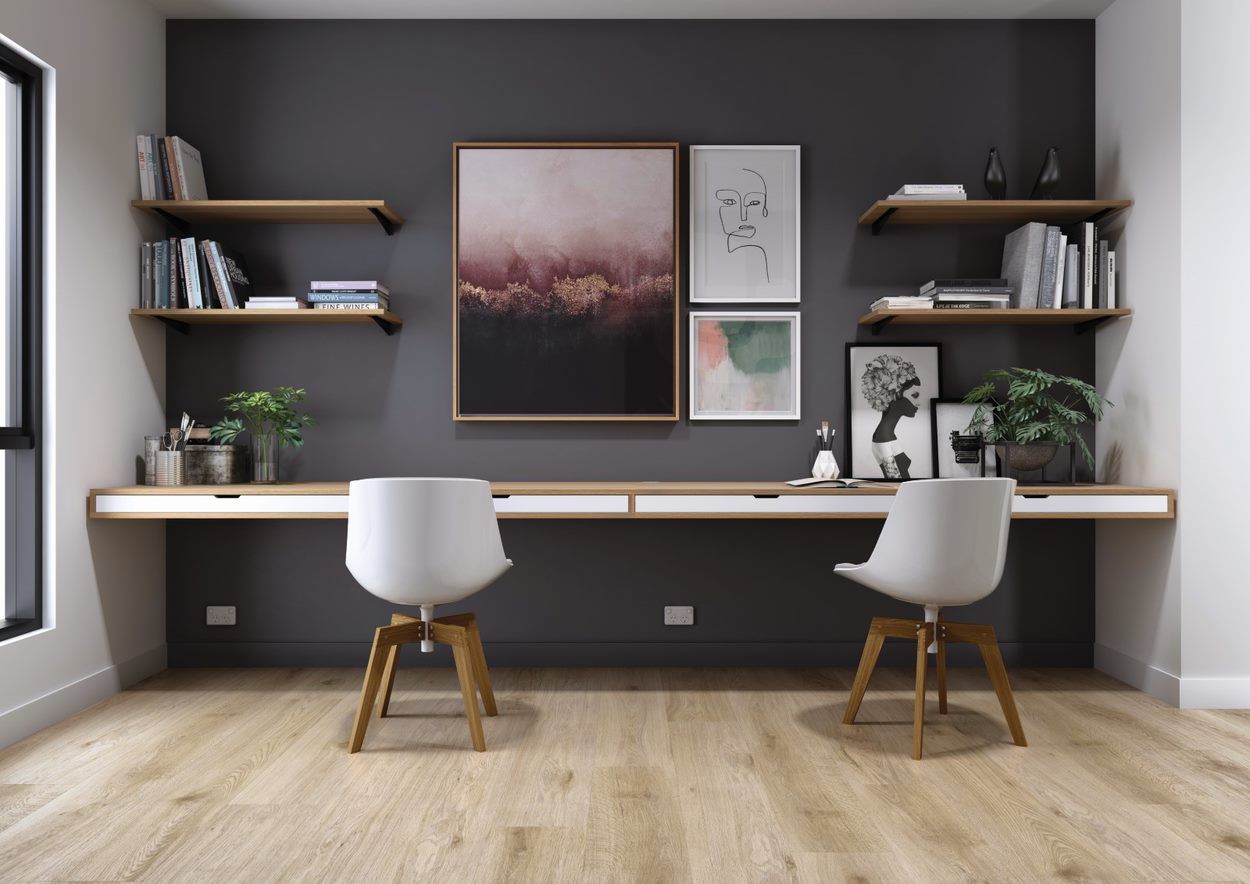 A Reading Room With Books in Shelves, Two Chairs and Wooden Floor — Flooring Suppliers in Port Macquarie, NSW
