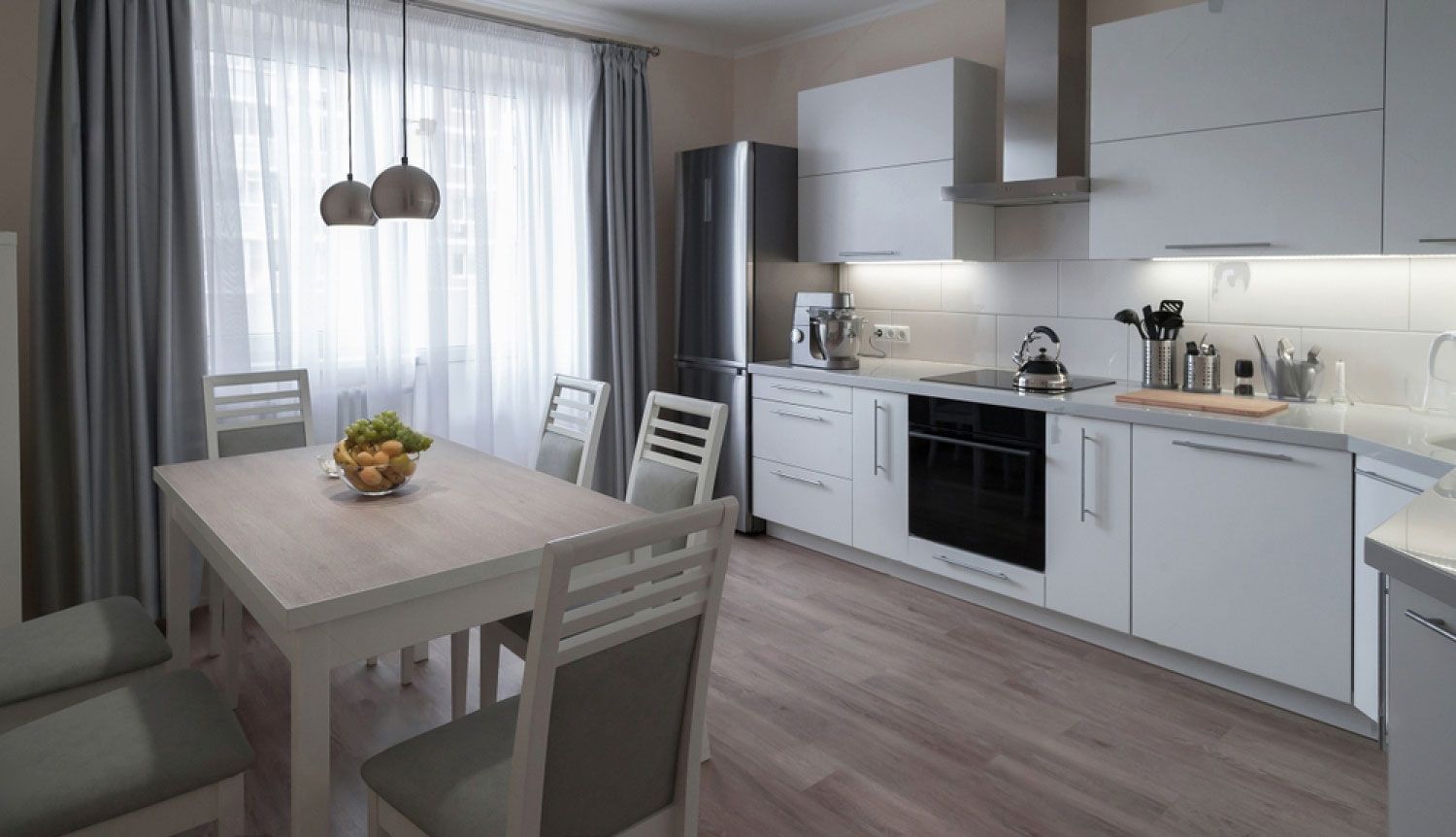 Clean kitchen with dining set — Floor Coverings in Harrington, NSW