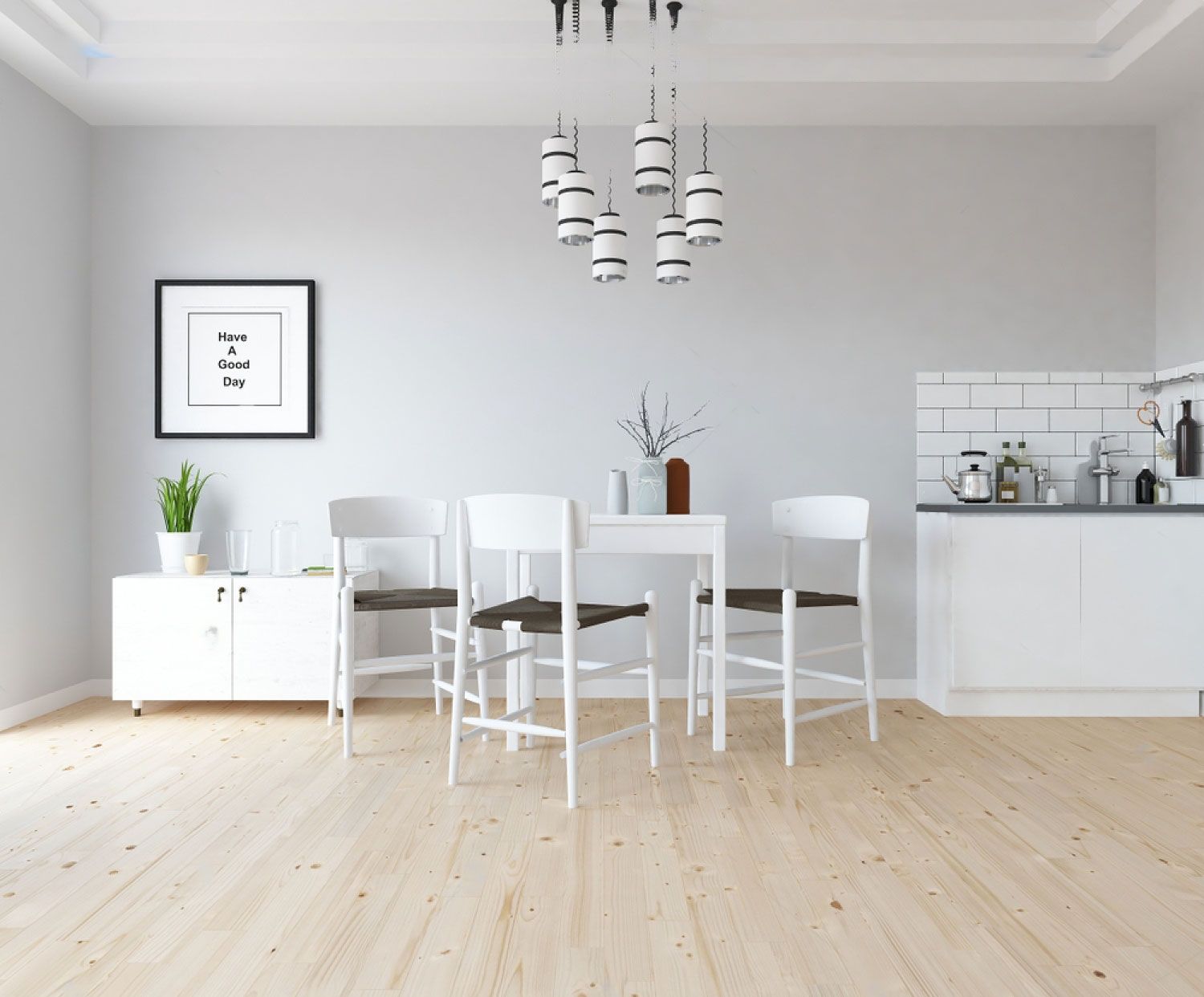 A dining room with a table and chairs and a picture on the wall