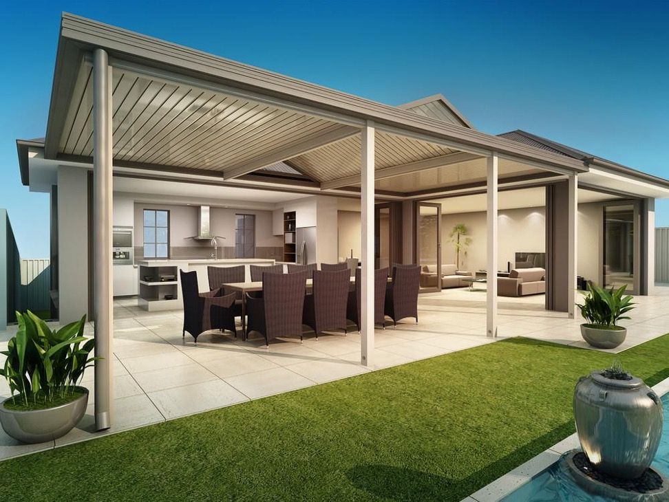 Patio with dining table, kitchen, and lounge area under a grey-roofed pergola, beside a pool and green lawn — Narellan Home Improvement Centre In Narellan, NSW
