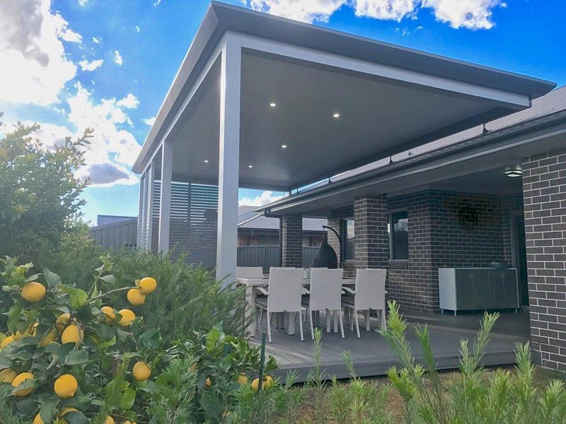 Outdoor Patio With Dining Table Under a Gray-roofed Structure — Narellan Home Improvement Centre In Narellan, NSW