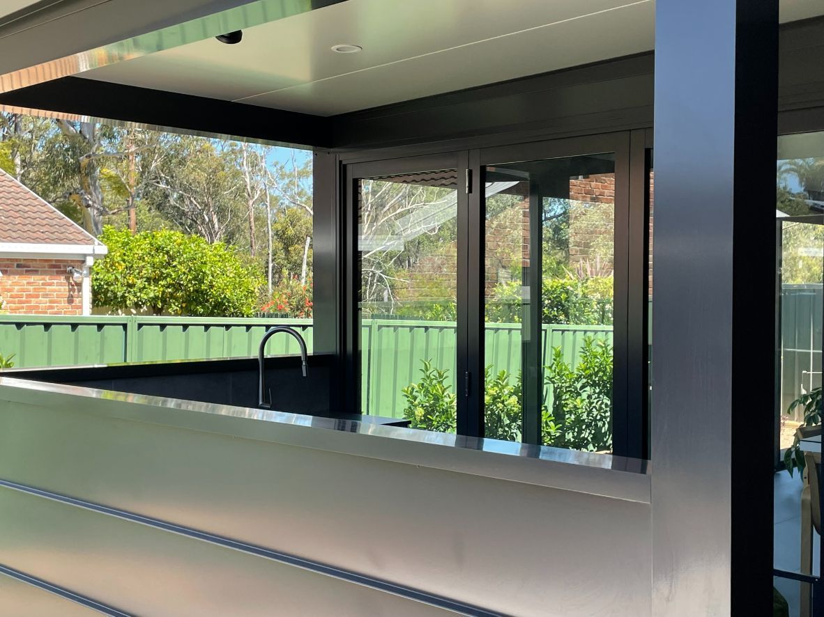 Outdoor Kitchen With a Bar, Sink, and Windows — Narellan Home Improvement Centre In Narellan, NSW