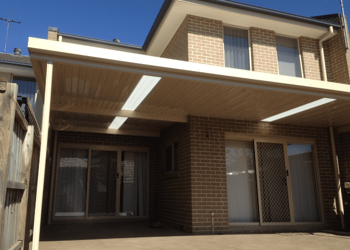 Beige-roofed Carport Attached to a Two-story Brick Building — Narellan Home Improvement Centre In Narellan, NSW