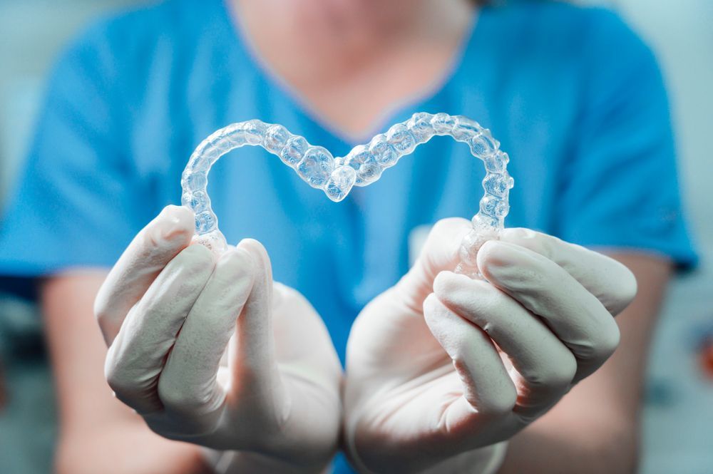 A woman is having her teeth examined by a dentist.