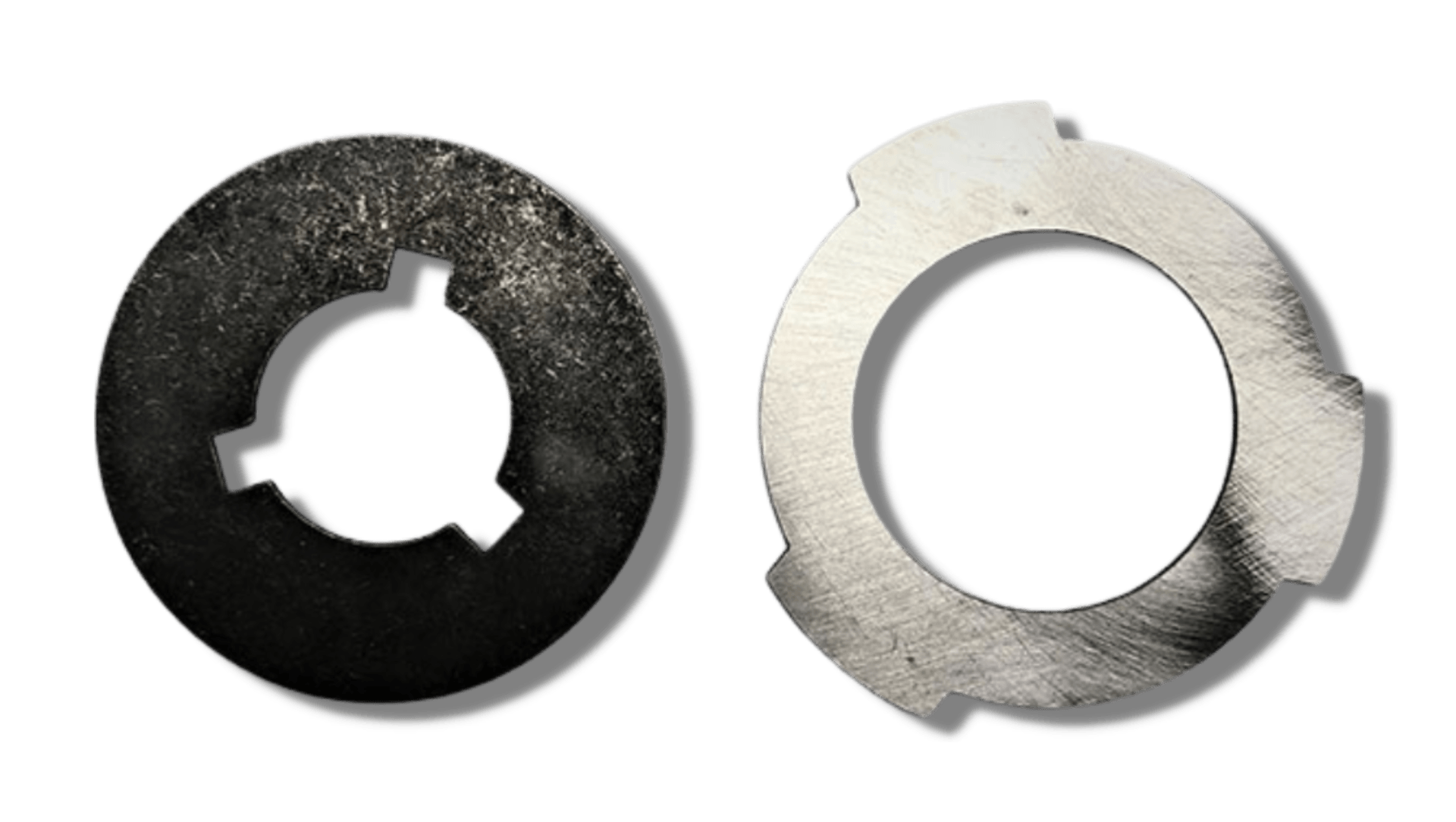 A black washer and a silver washer on a white background