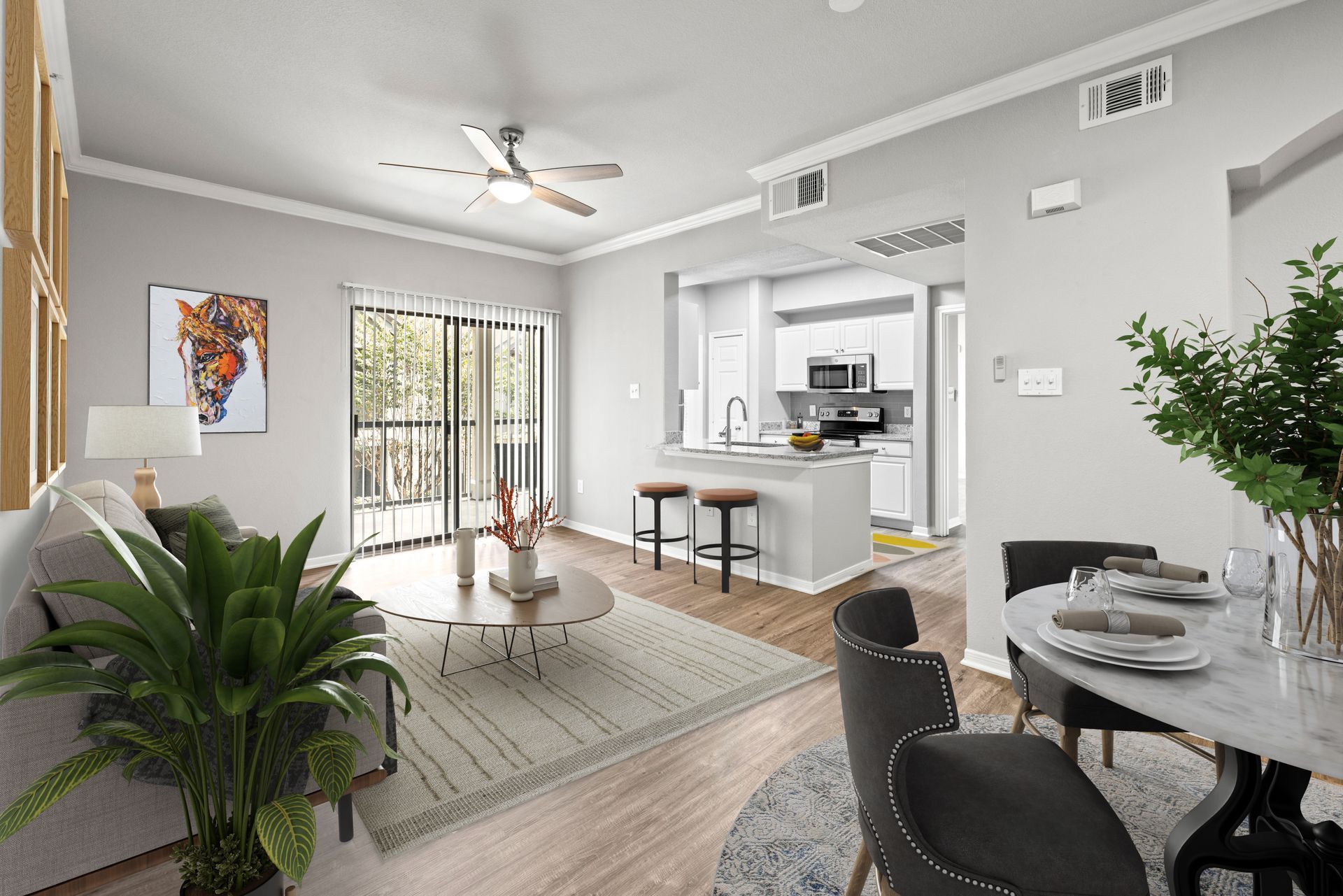 Bright modern apartment with open kitchen, dining nook, living area, and large windows.