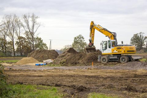 excavator scraping the sand