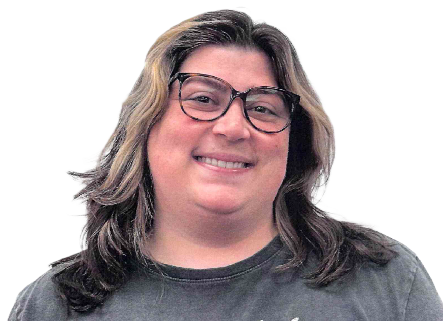 Woman with glasses smiles; medium-length hair, dark shirt, and white background.