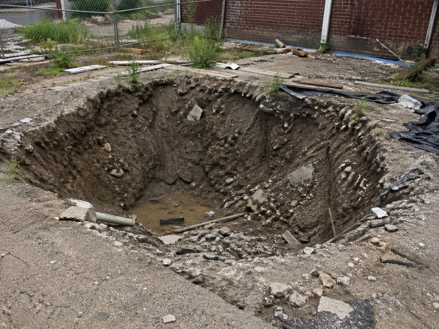 Contractor hole left abandoned.