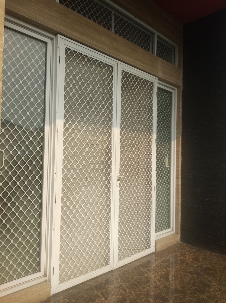 A White Security Screen Doors and Window — Downs Window Renewals in Harristown, QLD