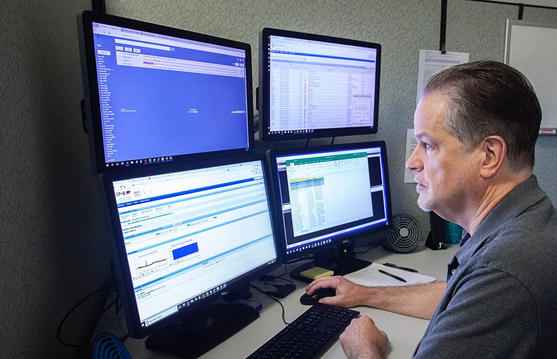 Two female network engineers monitoring computer screens