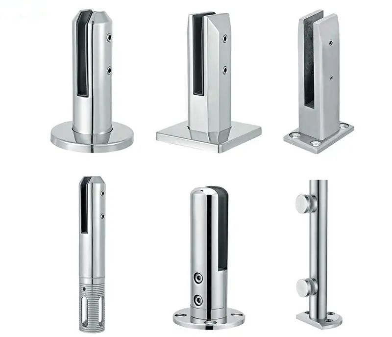 Various shiny stainless steel glass railing posts with different base shapes.