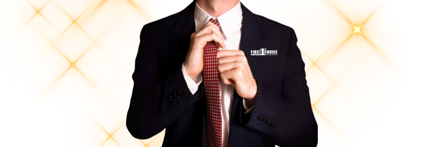 A man in a suit adjusts his red tie against a golden, star-burst background.