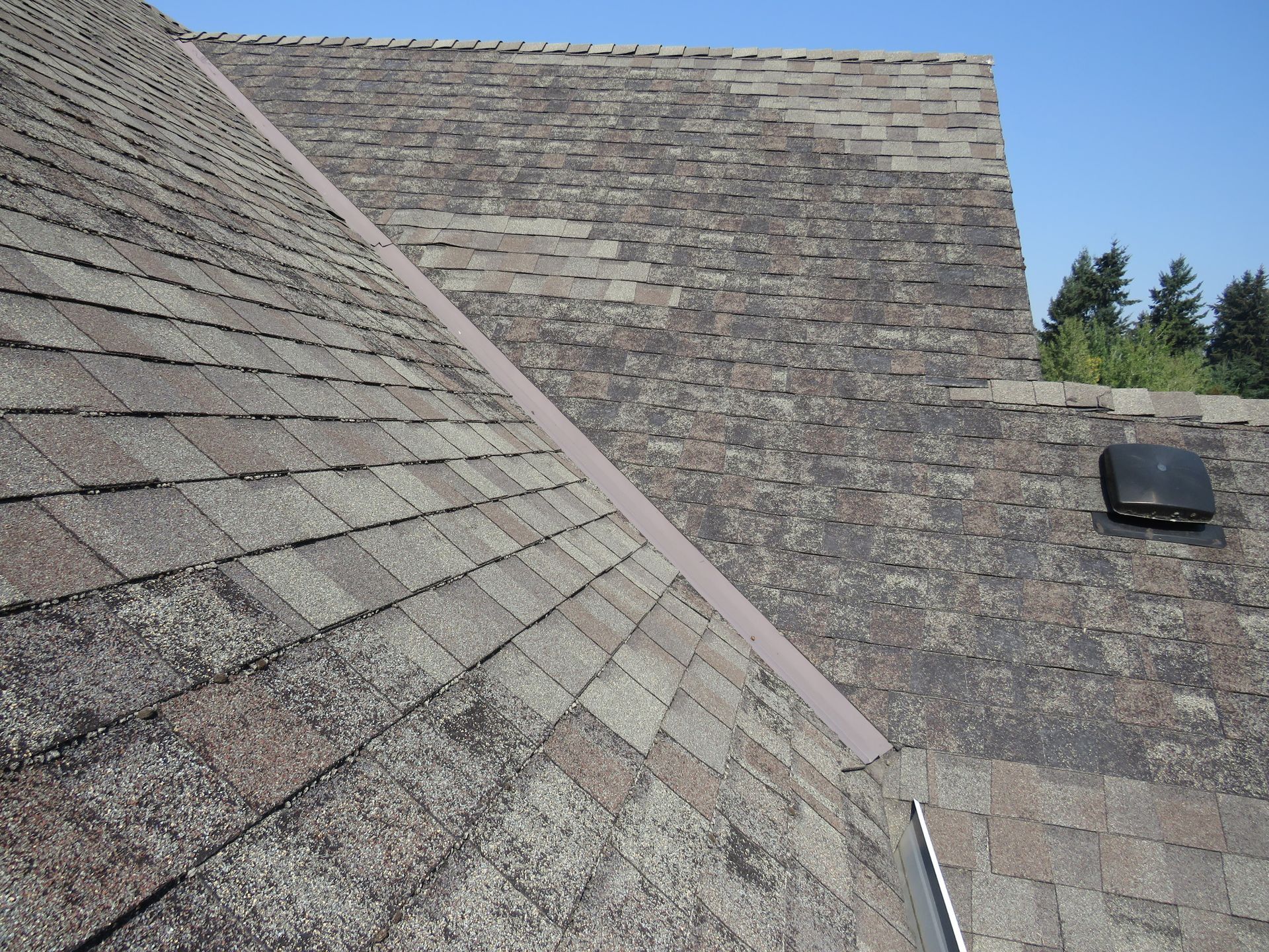A close up of a roof with a vent on it