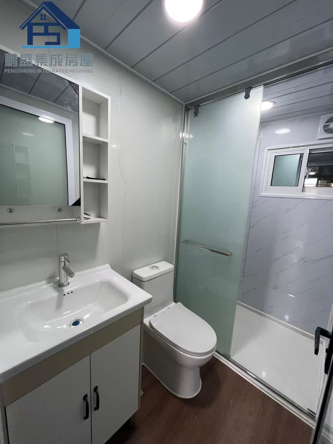 Bathroom Interior With White Fixtures, a Sliding Shower Door, and a Vanity — Expandable Housing in Inala, QLD
