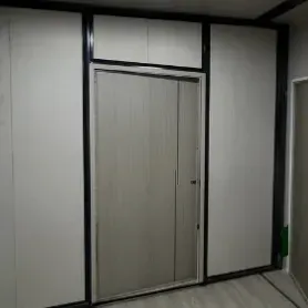 Sliding door with a grey wood-grain within a black aluminum frame_05