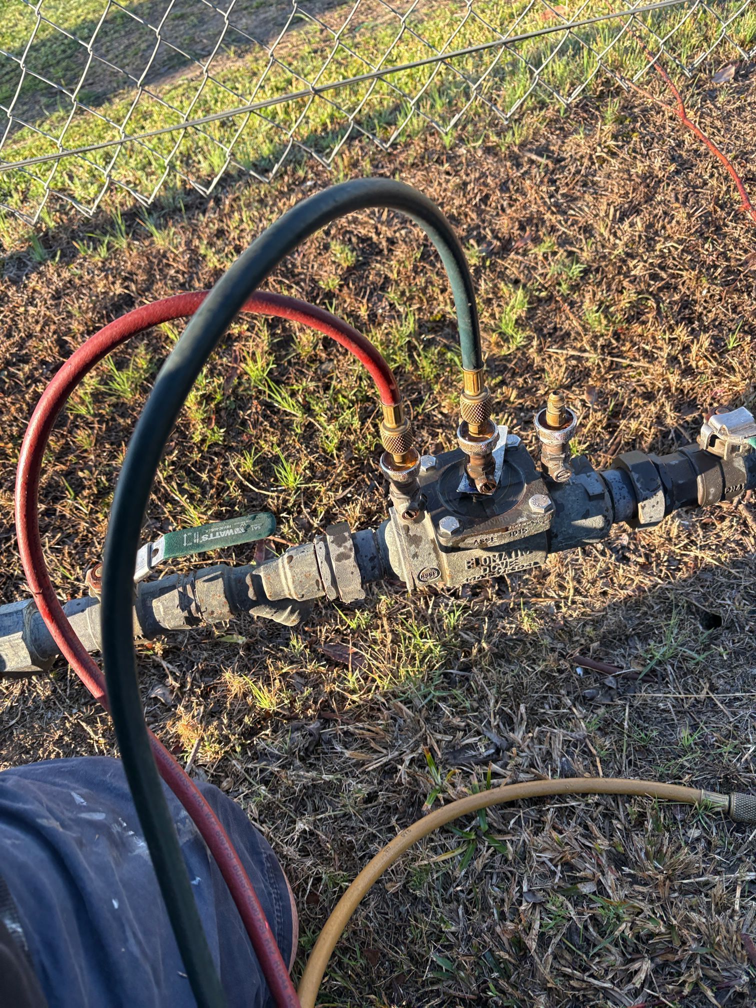Gauge and Hoses Attached to an Outdoor Pipe — Huddo's Plumbing Service in Port Stephens, NSW