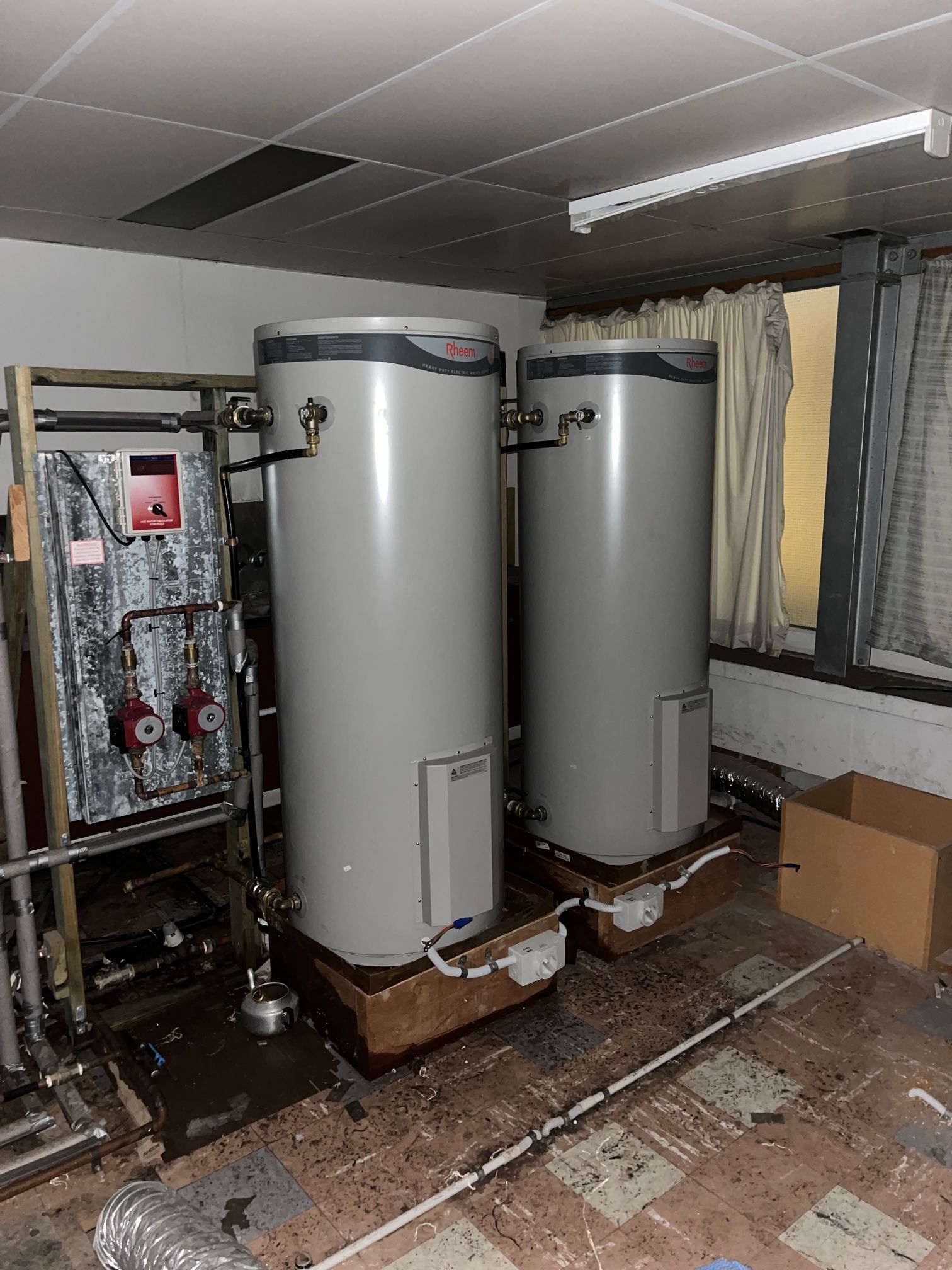 Boiler Room With Two Large Water Heaters — Huddo's Plumbing Service in Wallalong, NSW