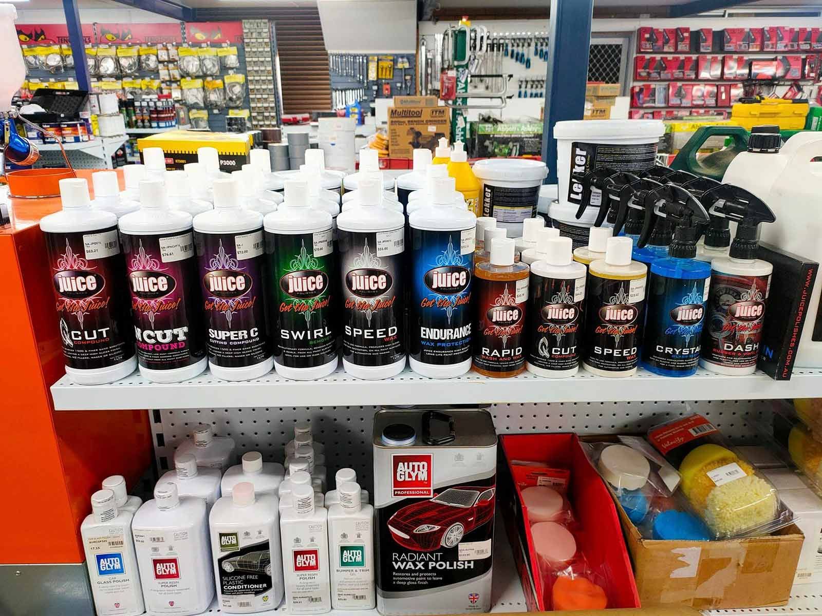 A Shelf Filled With Lots Of Bottles Of Cleaning Products In A Store — PT Trade Supplies in Taree, NSW