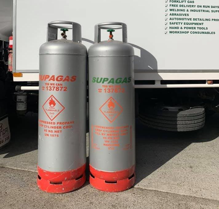 Three Gas Cylinders Are Sitting Next To Each Other On The Ground — PT Trade Supplies in Taree, NSW