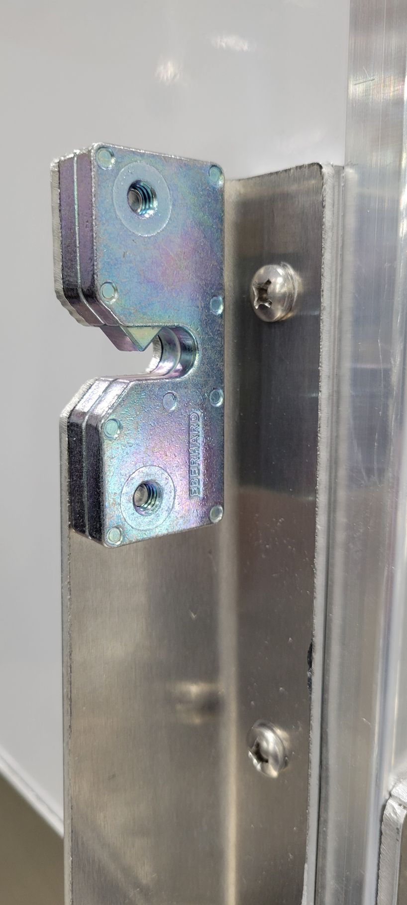 A close up of a metal object with holes in it.