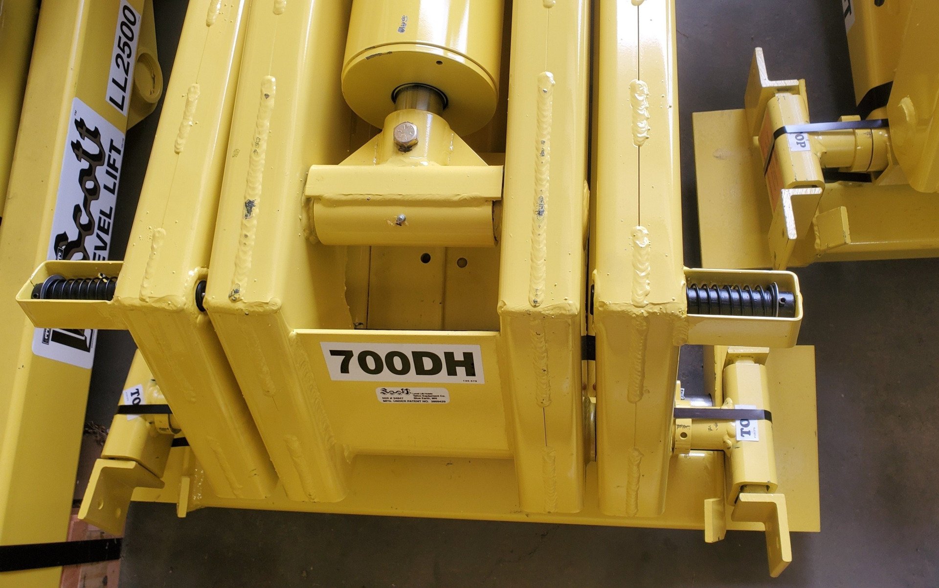 A yellow item with 700dh written on it