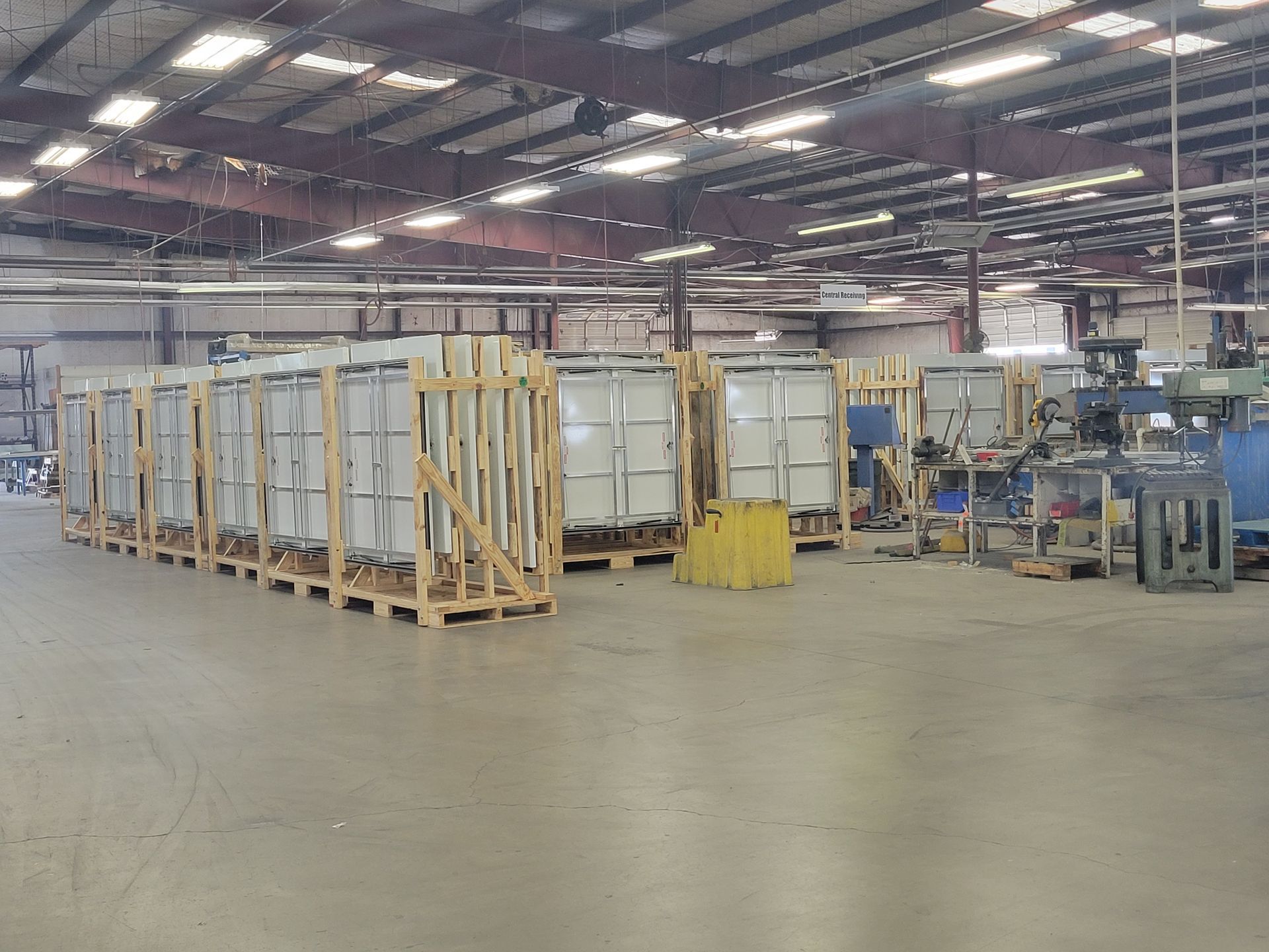 A large warehouse filled with lots of wooden crates.