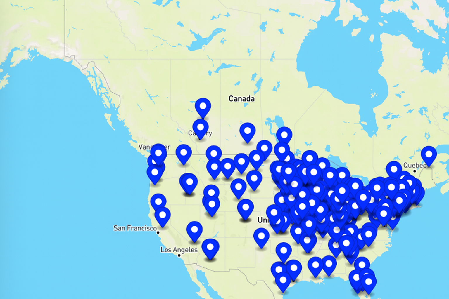 Map of the United States covered with many blue location pins, densely clustered in the East and South.