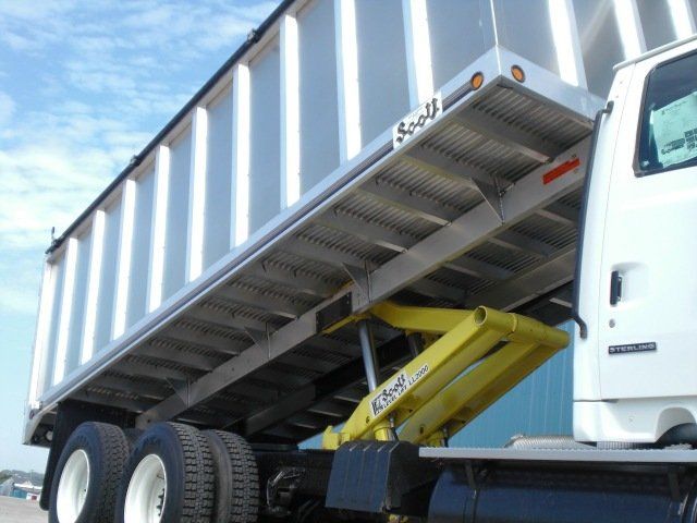 A dump truck with the word scott on the side