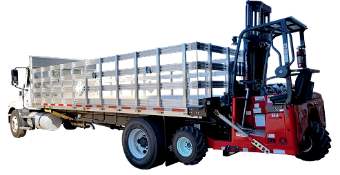 Red forklift carrying a white flatbed trailer loaded with cargo, side view on white background