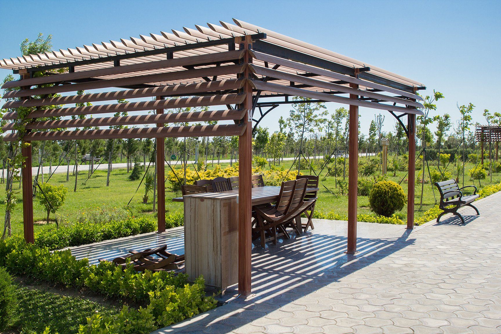 wooden pergola park garden table chairs