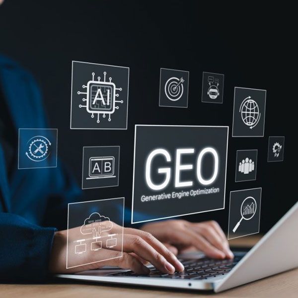 Hands typing on a laptop with floating tech icons and “GEO Generative Engine Optimization” on screen