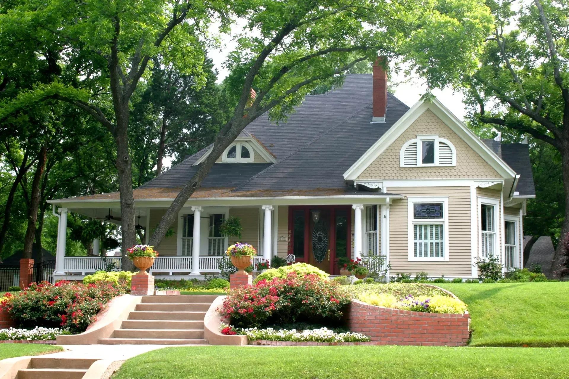 A house with a porch and stairs leading up to it