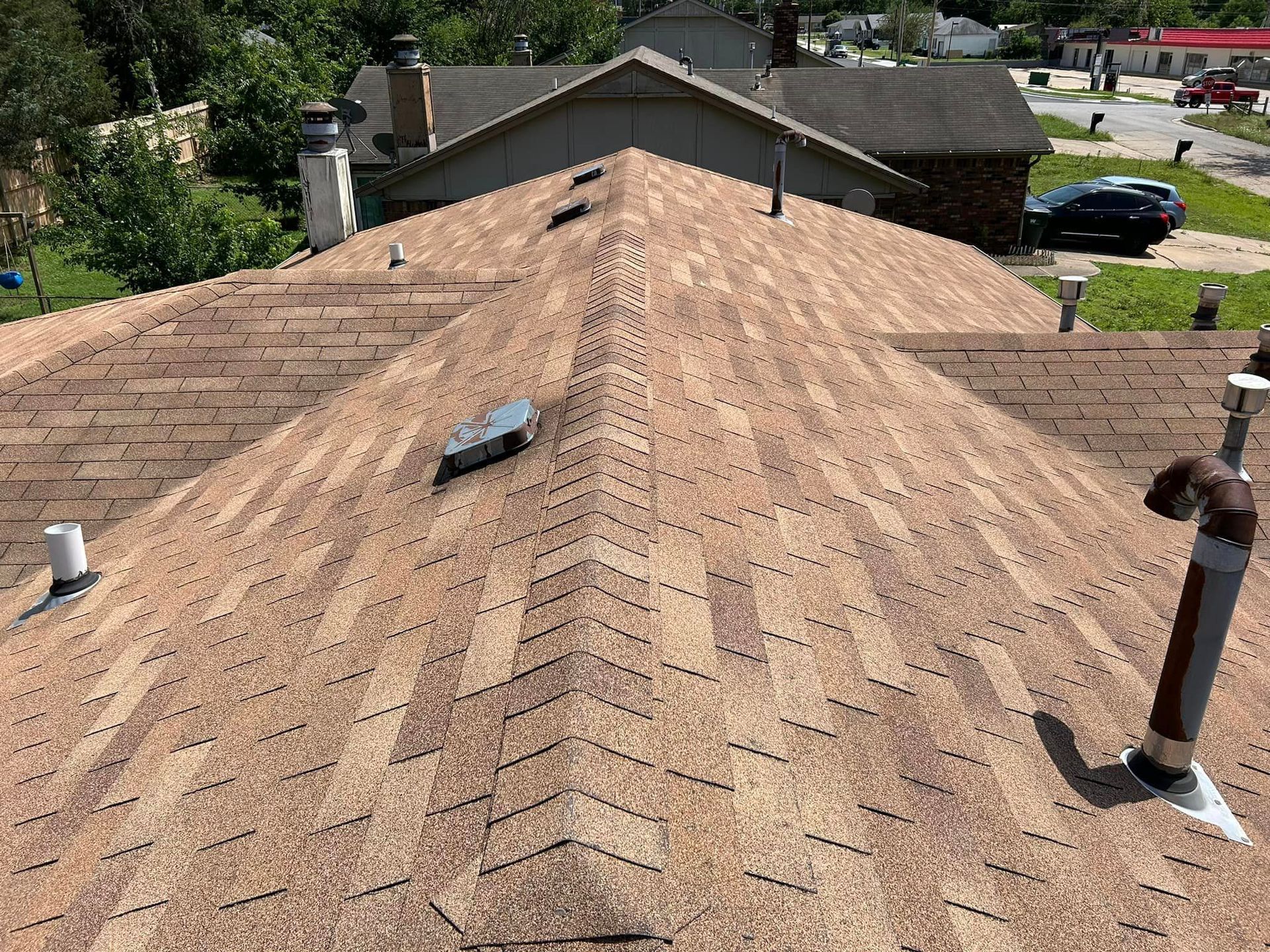 The roof of a house has a chevron pattern on it.