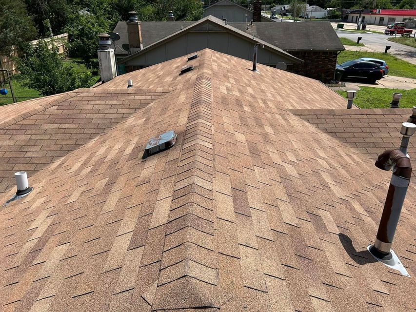 The roof of a house has a chevron pattern on it.