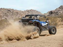 Back view of Can-Am vehicle with smoke on wheels