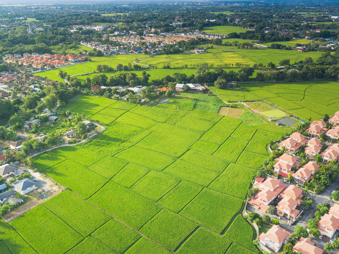 aerial view of land and neighborhoods