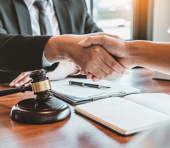 Businessmen Shaking Hands — Albany, OR — The Law Office of Dustan E. Johnson Businessmen Shaking Hands — Albany, OR — The Law Office of Dustan E. Johnson