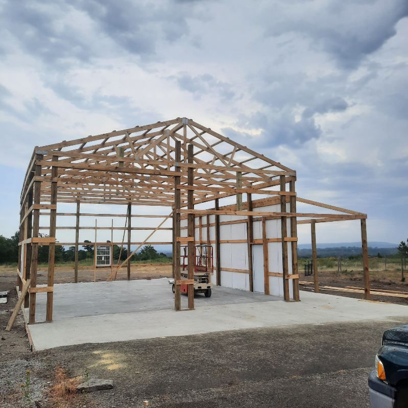 A Truck is Parked in Front of a Building Under Construction