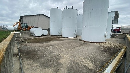 Small bulk storage facility storing tore chemicals, oil, and oil-containing of large industrial facility