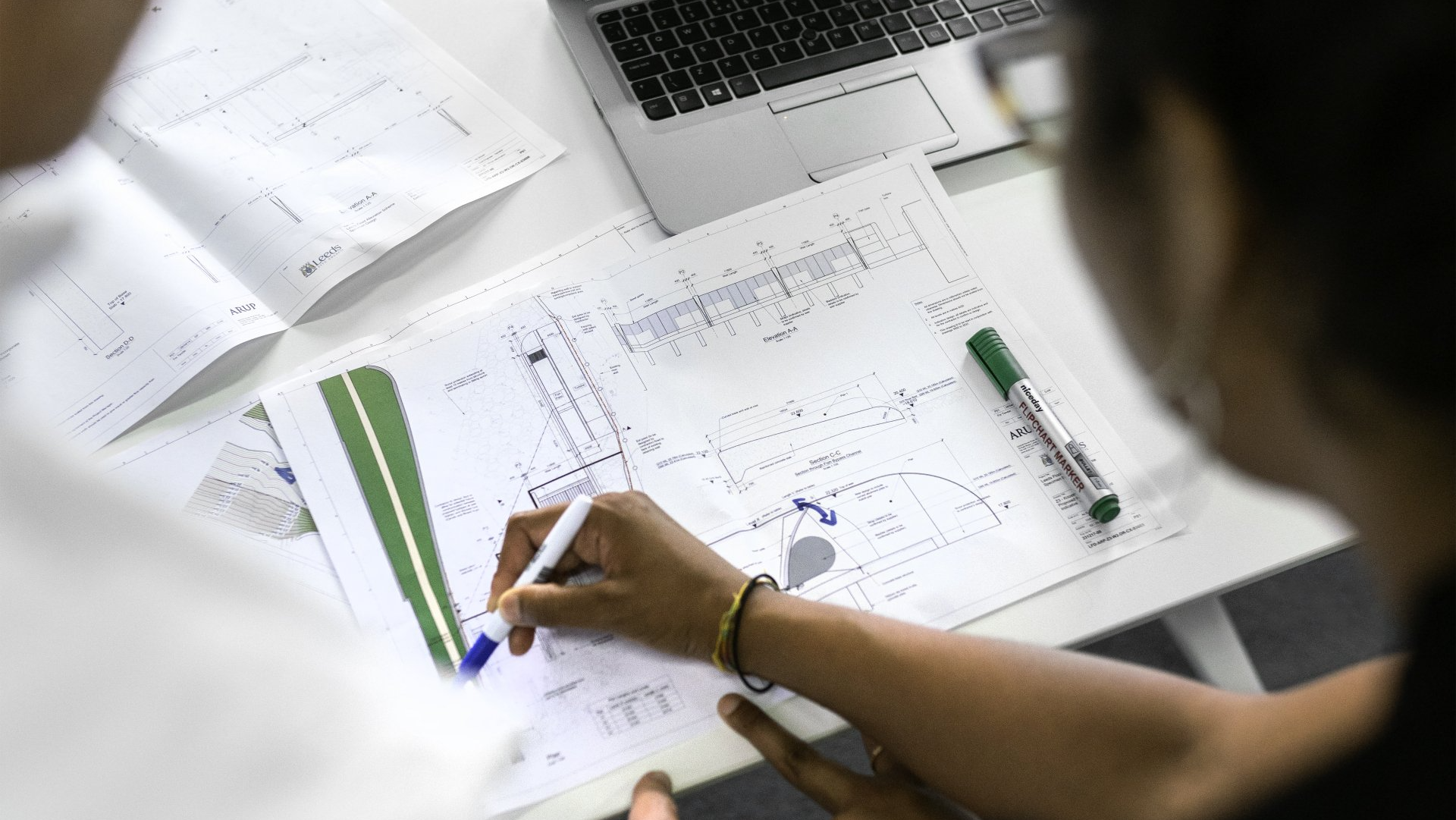 Engineer designing foundation systems, retaining walls, and pavements to prevent structural damage.