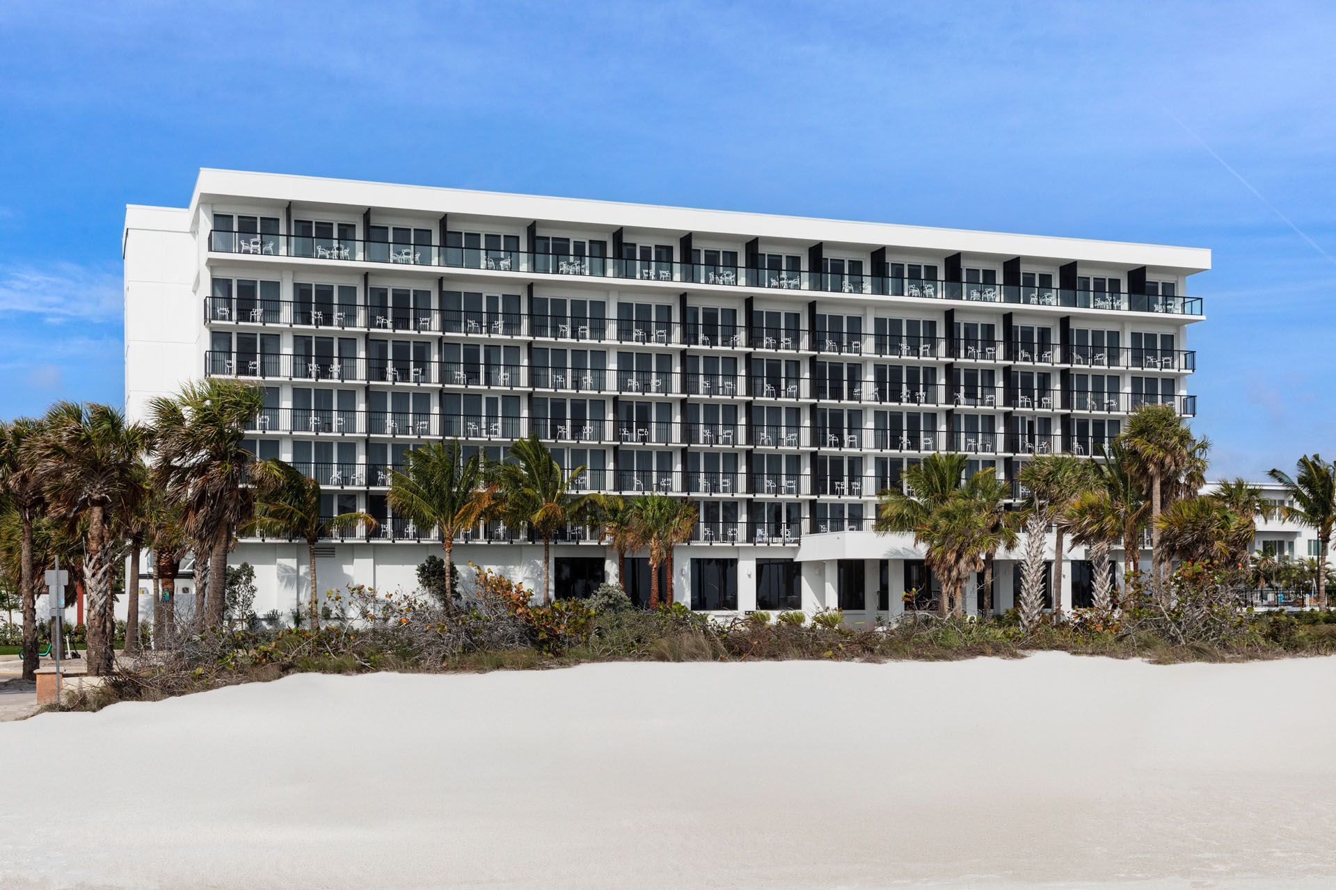 Cirque St Armands Beachside boutique hotel Sarasota Florida opened April 2025 circus themed Ringling history pool St Armands Circle