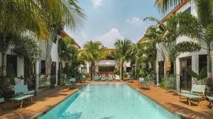 Maison Felix boutique hotel courtyard pool North Beach Miami Beach Florida restored 1948 building opened November 2025
