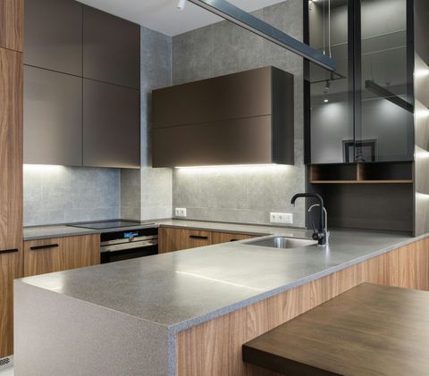 A kitchen with stainless steel appliances and wooden cabinets
