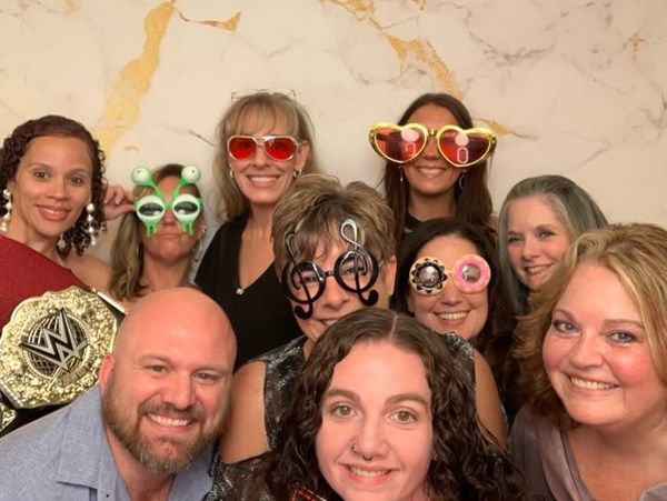 BFAIR staff celebrating with props