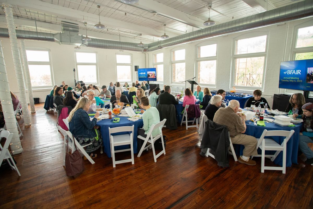 People at tables at the BFAIR Annual Meeting